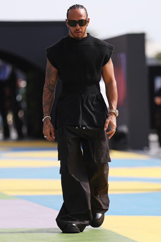 Lewis Hamilton wears Rick Owens and Prada sunglasses at the Saudi Arabian Grand Prix, along with a Pilot's Chronograph Watch from IWC, featured in Top Gun.