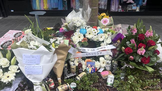 Flowers on Little Malop St pay tribute to Jayme Sykes.