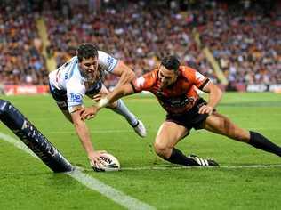 UP THERE WITH THE BEST: Storm player Billy Slater fails to stop Titans player Anthony Don scoring a try during the Round 10 NRL match between the Melbourne Storm and the Gold Coast Titans at Suncorp Stadium in Brisbane, in May this year. Picture: DAVE HUNT