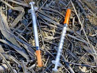 Gympie council workers found uncapped syringes in a local street recently. Picture: Paul Braven GLA160617NEEDLE