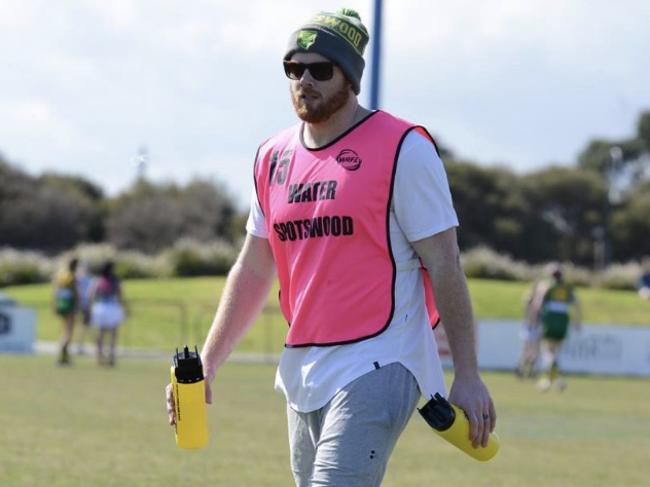 Adam Cooney runs water for his wife's footy team, Spotswood. Picture: @21Dreams