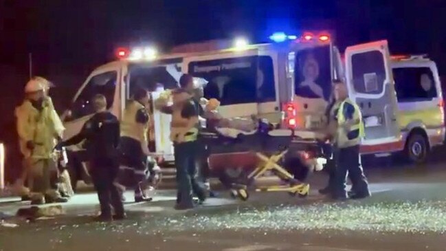 Paramedics load a critically injured teen into an ambulance after a traffic collision between a Kawasaki dirt bike and the Blacks Beach Tavern courtesy bus. Picture: Tara Miko