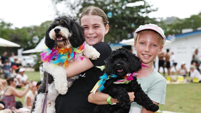 Estella Spence and Benji and Annika van der Straaten and Alfie attended the dog show at Port Douglas Carnivale's family beach day, held on Four Mile Beach and the Port Douglas Surf Lifesaving Club. Picture: Brendan Radke