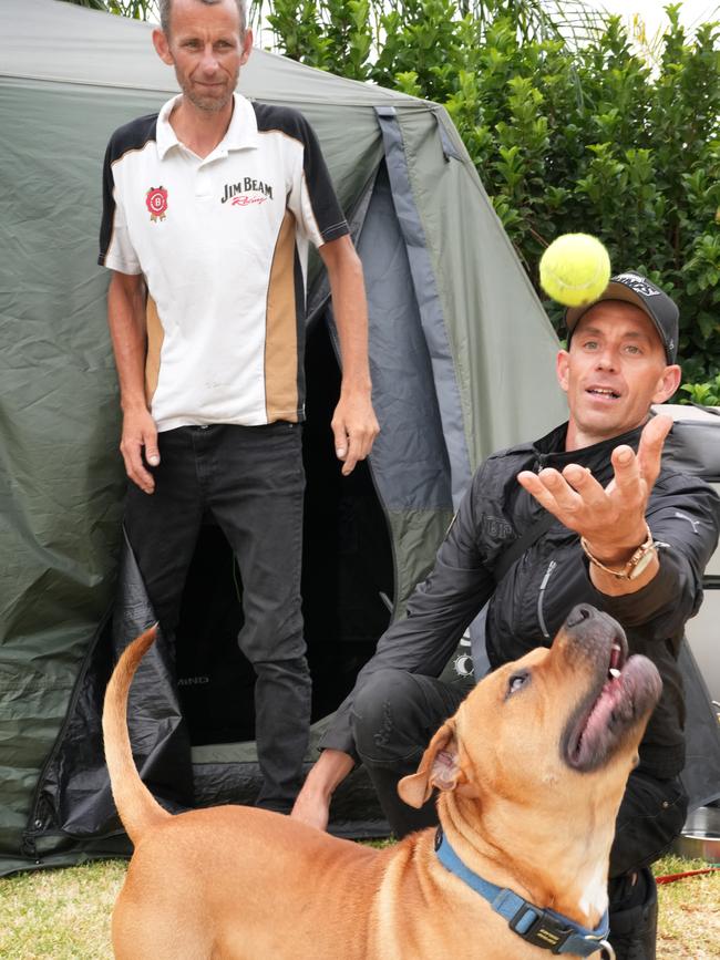 Identical twins, Scott (standing), and Matt Bleach, their dog Brutus, are hoping change in their life is just around the corner. Picture: Dean Martin