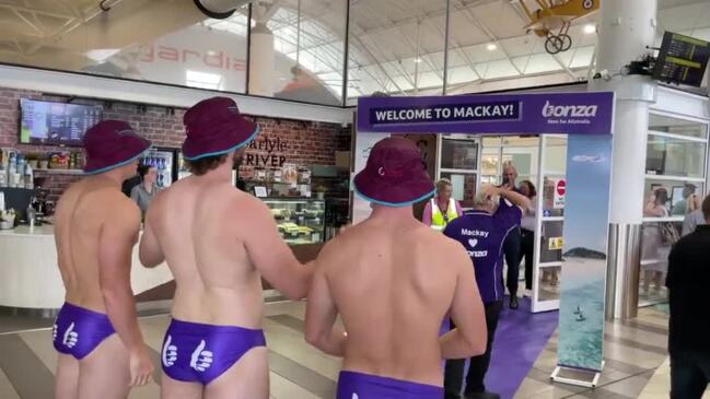 Mackay Cutters players welcome passengers on Bonza Airline's first Mackay flight