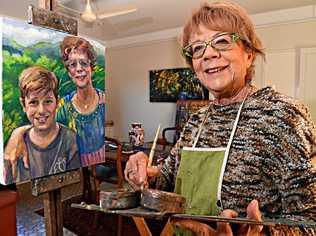 READY TO PAINT: Buderim artist Jose McInnnes with artwork of herself and her grandson. Picture: Warren Lynam
