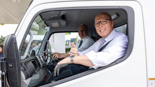 Peter Dutton arrives at a petrol station in Hoxton Park in Sydney with Sam Kayal to discuss the cost of fuel on the campaign trail. Picture: Thomas Lisson/NewsWire