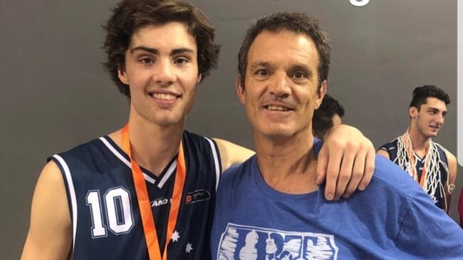 Warrick Giddey, pictured with son Josh, has backed a new indoor stadium for Yarraville.