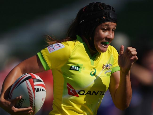 Page McGregor of Australia scoring a try at the Dubai rugby sevens event.