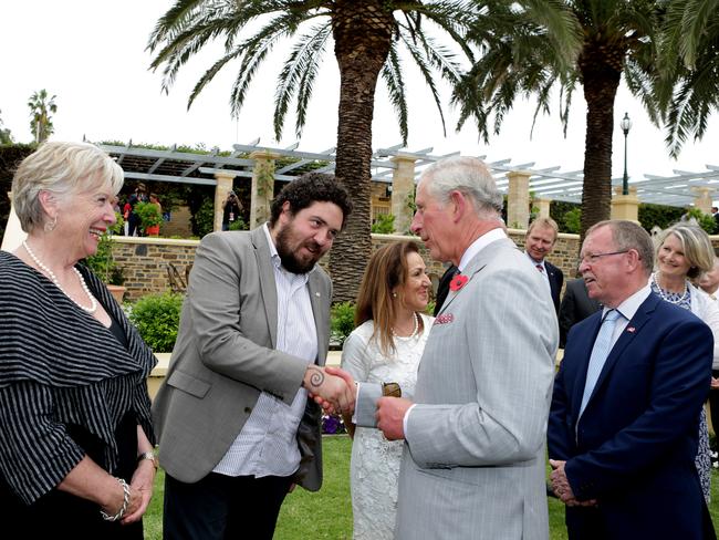 Welgemoed meets Prince Charles during a wine tasting at Seppeltsfield Winery in the Barossa in 2015 as another SA food legend, Maggie Beer, looks on. Picture: Dylan Coker