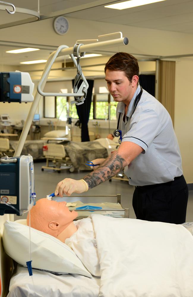 Practical learning: Cameron McDonald is in his first year of a Bachelor of Nursing Science at JCU Townsville, where nursing degrees are becoming more popular than ever. Picture: Wesley Monts
