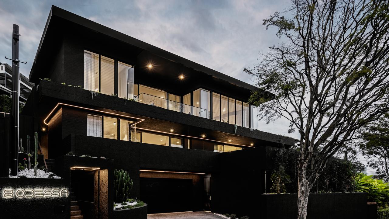 This property at 8 Odessa St, Holland Park West, is a dark and moody home in suburban Brisbane.