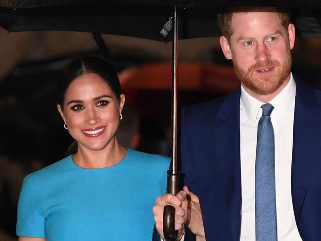 Britain's Prince Harry, Duke of Sussex (R) and Meghan, Duchess of Sussex arrive to attend the Endeavour Fund Awards at Mansion House in London. Picture: AFP