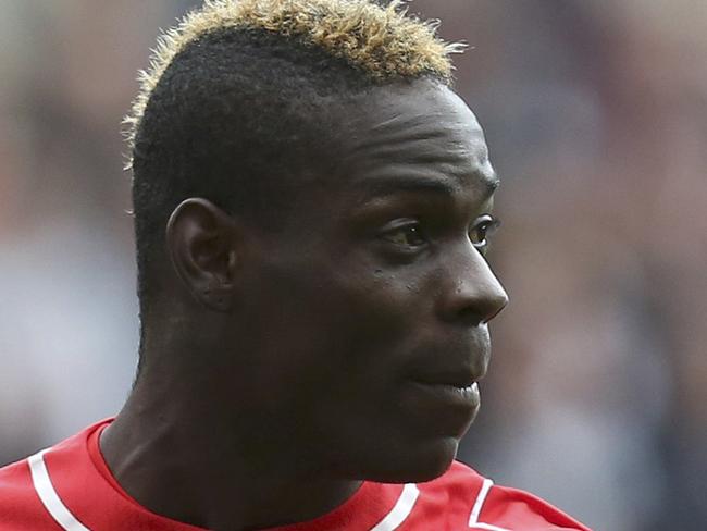 FILE - This is a Saturday, Nov. 1, 2014 file photo of Liverpool's Mario Balotelli as he gestures during the English Premier League soccer match against Newcastle United at St James' Park, Newcastle, England. Balotelli is Tuesday Dec. 2, 2014, facing an investigation from the English Football Association after a post on social media site Instagram was criticized for being racist and anti-Semitic. Balotelli uploaded a picture of the video game character Super Mario, with whom the Italy international shares a nickname, with text around the image including "jumps like a black man and grabs coins like a Jew." (AP Photo/Scott Heppell)