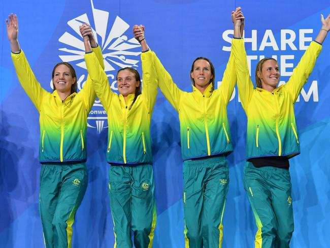 (L-R) Emily Seebohm, Georgia Bohl, Emma McKeon and Bronte Campbell of Australia during the medal ceremony for the Womens 4x100m Medley Relay Final on day six of swimming competition at the XXI Commonwealth Games at Gold Coast Aquatic Centre on the Gold Coast, Australia, Tuesday, April 10, 2018. (AAP Image/Darren England) NO ARCHVING, EDITORIAL USE ONLY