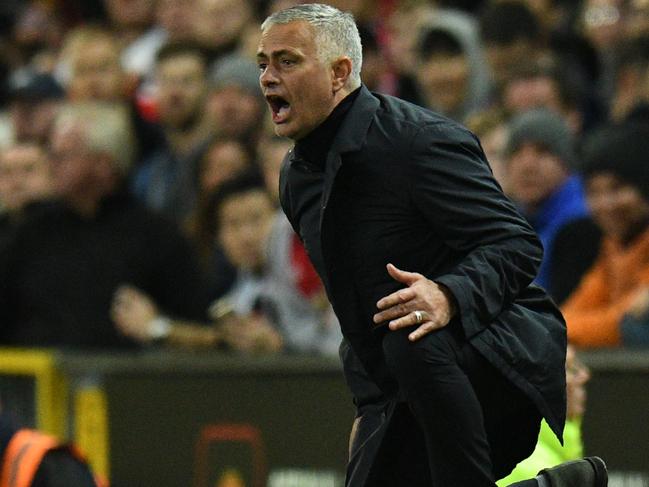 Manchester United's Portuguese manager Jose Mourinho gestures during the English Premier League football match between Manchester United and Newcastle at Old Trafford in Manchester, north west England, on October 6, 2018. (Photo by Oli SCARFF / AFP) / RESTRICTED TO EDITORIAL USE. No use with unauthorized audio, video, data, fixture lists, club/league logos or 'live' services. Online in-match use limited to 120 images. An additional 40 images may be used in extra time. No video emulation. Social media in-match use limited to 120 images. An additional 40 images may be used in extra time. No use in betting publications, games or single club/league/player publications. /