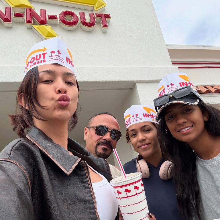 Kat Clark (left), with her husband Jonathan, and daughters Deja, 14, and Latisha, 21. Picture: Instagram/kat_clark_