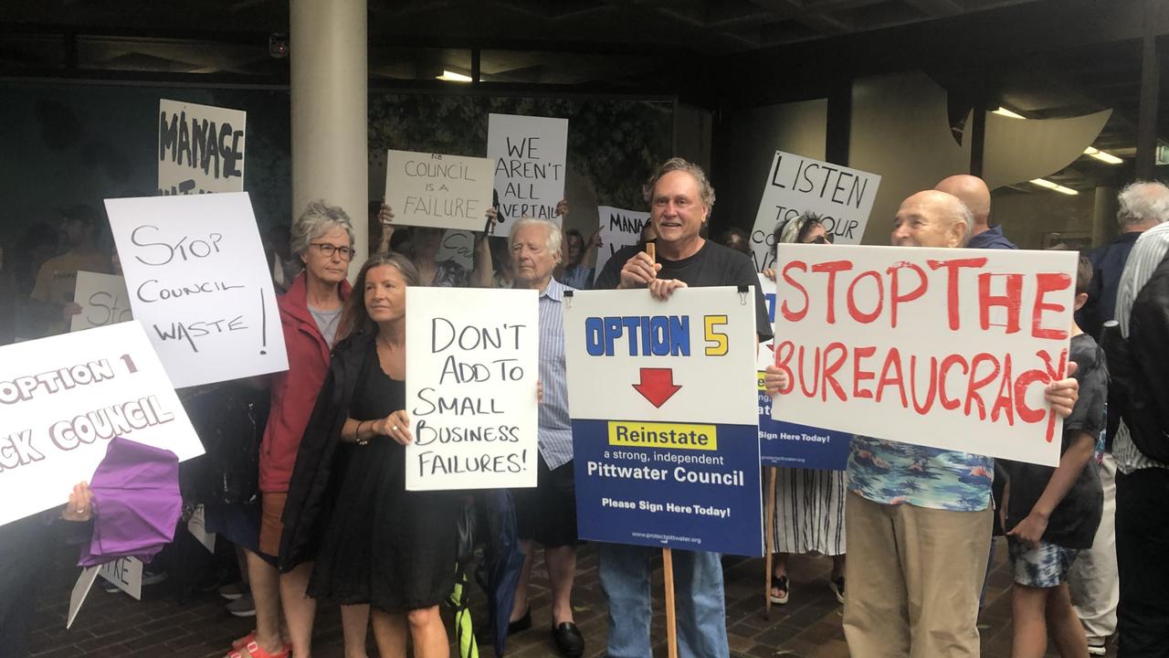 Ratepayers outside the Northern Beaches Council chambers on Tuesday night during a protest over proposed rate increases. Picture: Jim O’Rourke