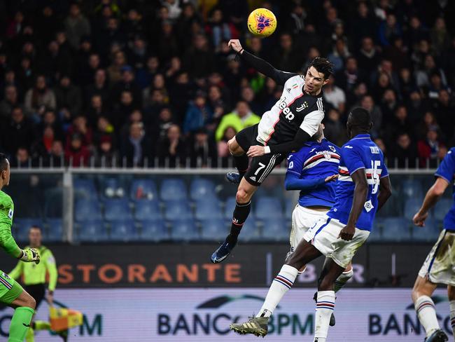 Cristiano Ronaldo (C) soars to score a header during the Italian Serie A football match Sampdoria vs Juventus on December 18, 2019. Picture: Marco Bertorello / AFP