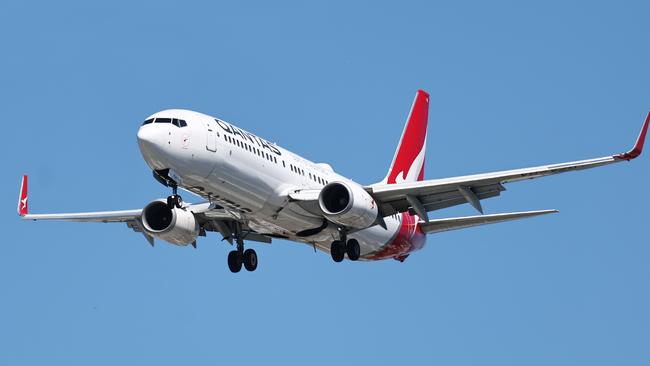 A Qantas commercial passenger jet plane comes into land at the Cairns International Airport, increasing tourism numbers in Far North Queensland. Picture: Brendan Radke