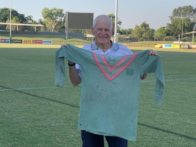 Ian ‘Snow’ Davis holding his jersey from the 1960 game between the NT and France in Darwin.