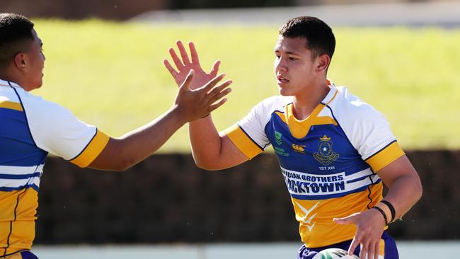 Tauvao Falaniko celebrates a try against St Dominic’s. Picture: Jonathan Ng