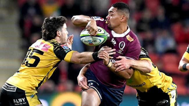 Reds winger Chris Feauai-Sautia tries to slice through the Force defence. Picture: Getty Images