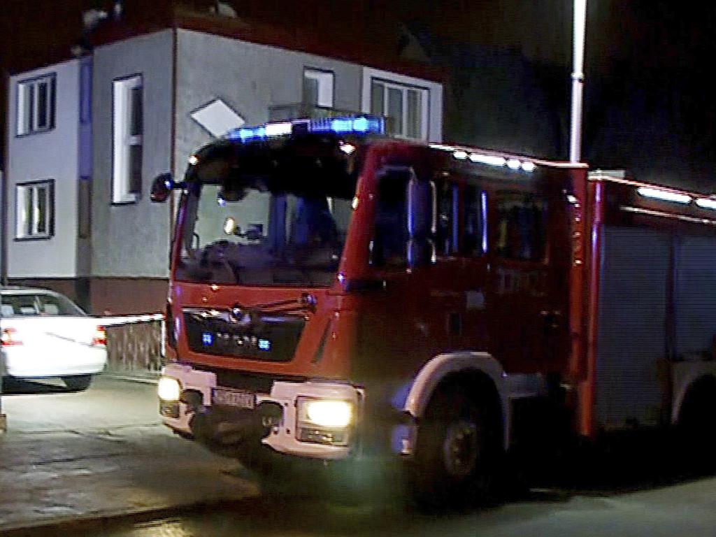 A fire engine stands outside the escape room game in Koszalin, northern Poland, where five teenage girls died from asphyxiation. Picture: AP Photo/TVN News via AP