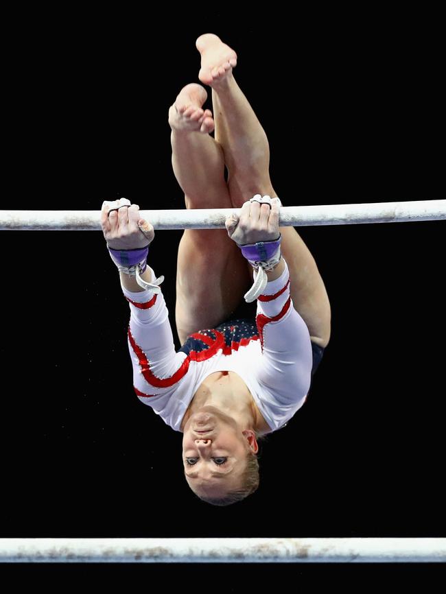 Larrissa Miller in action on the uneven bars.