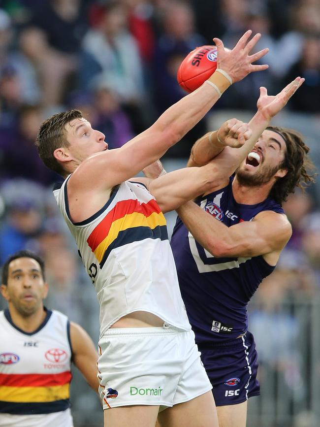 Adelaide’s Josh Jenkins has his mark spoiled by Fremantle’s Alex Pearce. Picture: Paul Kane/Getty