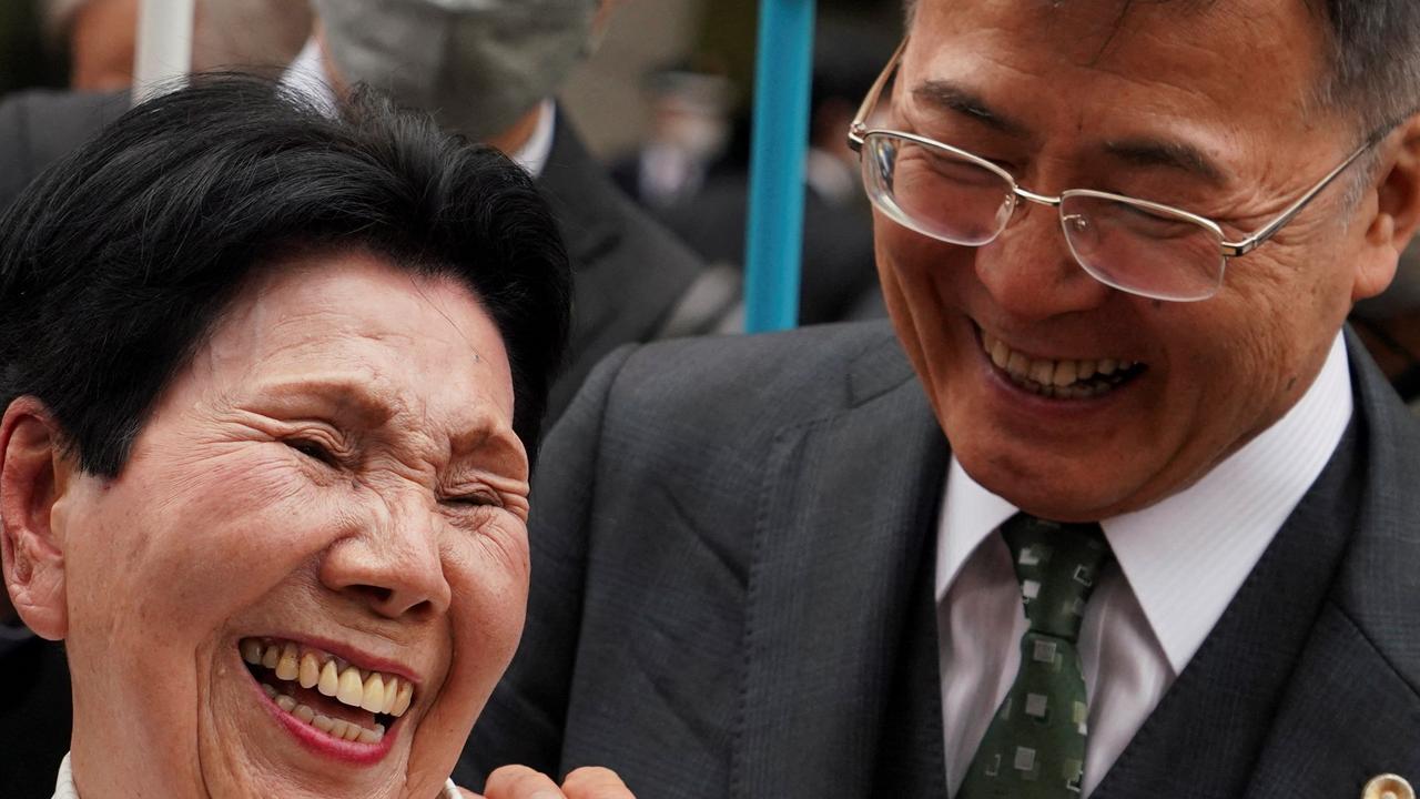 Hideko Hakamada (l) and Hideyo Ogawa (r), a lawyer for her brother Iwao Hakamada, share a smile in front of the Tokyo High Court on March 13 this year. Picture: AFP