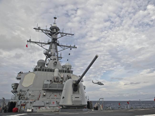 This US Navy photo obtained October 21, 2016 shows An MH-60R Sea Hawk, assigned to Helicopter Maritime Strike Squadron (HSM) 49,as it takes off from the flight deck aboard the guided-missile destroyer USS Decatur (DDG 73) on September 14, 2016 in the Sea of Japan.  A US destroyer sailed close to a string of islands claimed by China in the South China Sea on October 21, 2016, the Pentagon said, amid continued tensions in the contested waterway. The USS Decatur passed close to the Paracel Islands and "conducted this transit in a routine, lawful manner without ship escorts and without incident," Pentagon spokesman Commander Gary Ross said.  / AFP PHOTO / Navy Media Content Operations (N / MC3 Gerald Dudley REYNOLDS / RESTRICTED TO EDITORIAL USE - MANDATORY CREDIT "AFP PHOTO / US NAVY/Specialist 3rd Class Gerald Dudley Reynolds" - NO MARKETING NO ADVERTISING CAMPAIGNS - DISTRIBUTED AS A SERVICE TO CLIENTS