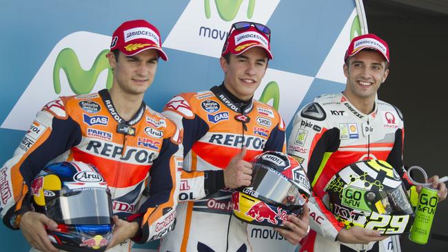 Dani Pedrosa, Marc Marquez and Andrea Iannone celebrate at the end of the MotoGP of Spain qualifying practice at Motorland Aragon Circuit.