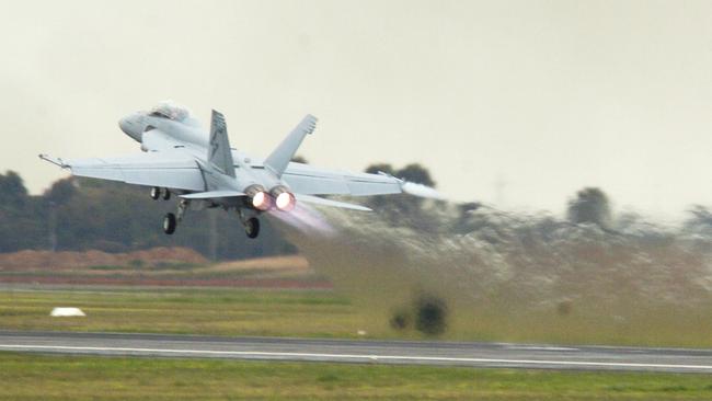 A F/A-18F Super Hornet takes off at the RAAF base at Edinburgh. 