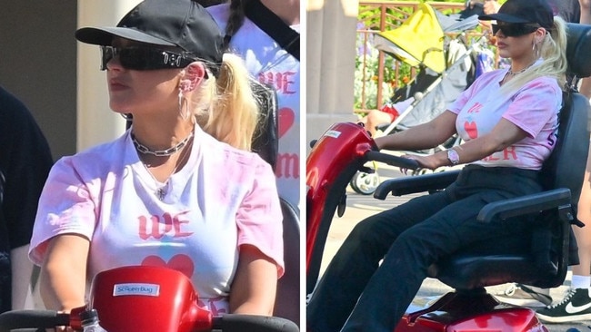 Christina Aguilera rides mobility scooter in Disneyland