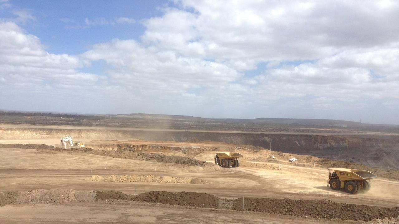 An excavator and haul trucks at Daunia mine in Central Queensland. PIC: OWEN JACQUES