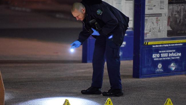 Police comb the scene of a stabbing at Elizabeth Shopping Centre. Picture: Tom Huntley