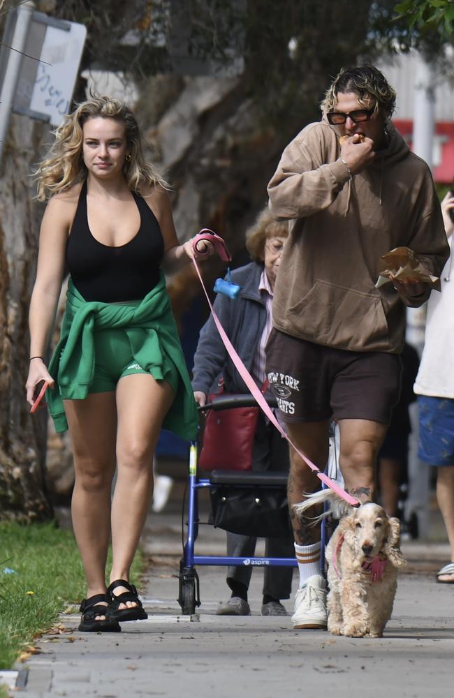 Abbie Chatfield and boyfriend Konrad Bien-Stephens take their new dog out for a walk in Bondi. Picture: Media Mode