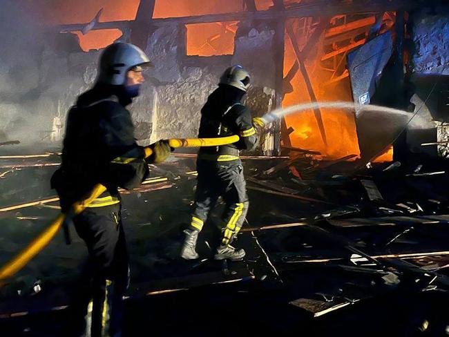 Ukrainian rescuers put out a fire following a drone attack on an industrial facility in Uman, Cherkasy region. Picture: AFP