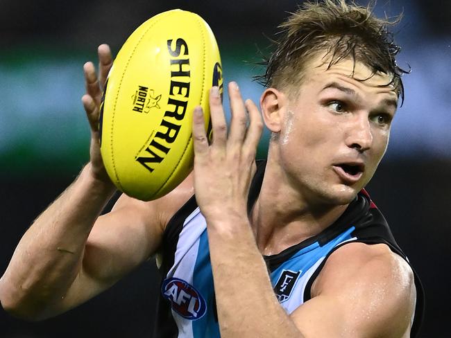 MELBOURNE, AUSTRALIA - MARCH 21: Ollie Wines of the Power marks during the round one AFL match between the North Melbourne Kangaroos and the Port Adelaide Power at Marvel Stadium on March 21, 2021 in Melbourne, Australia. (Photo by Quinn Rooney/Getty Images)