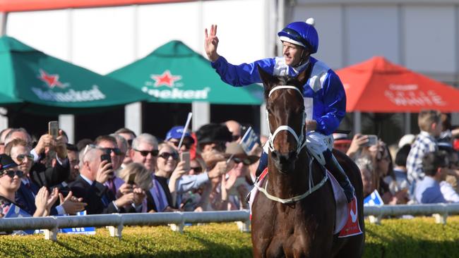 Everyone loves a winner: Jockey Hugh Bowman and Winx. Picture: AAP