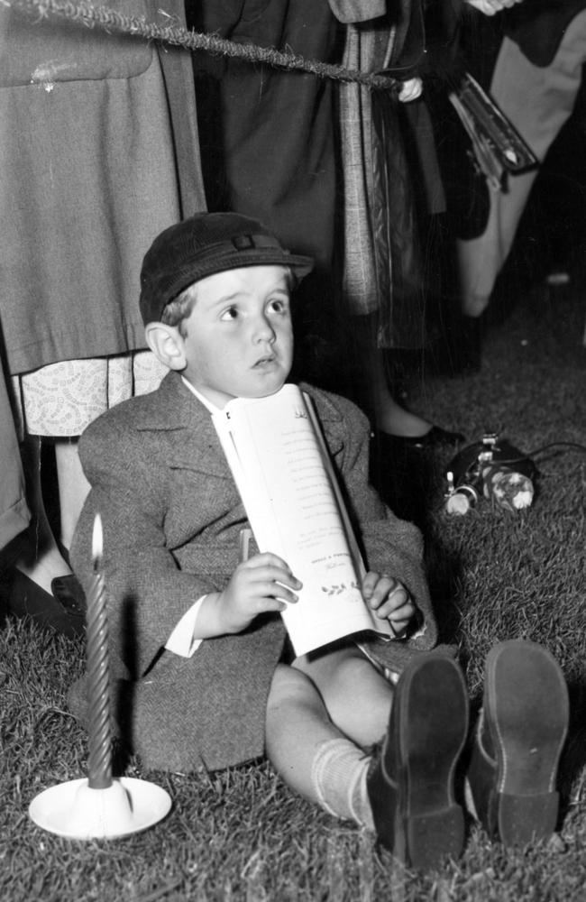 Graham Elkin, 4, of Windsor, had a perfect spot to watch the choir at Carols by Candlelight in 1955.