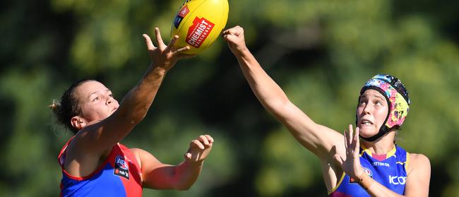 Maddison Gay (left) of the Demons in action against Tori Groves-Little (right). 