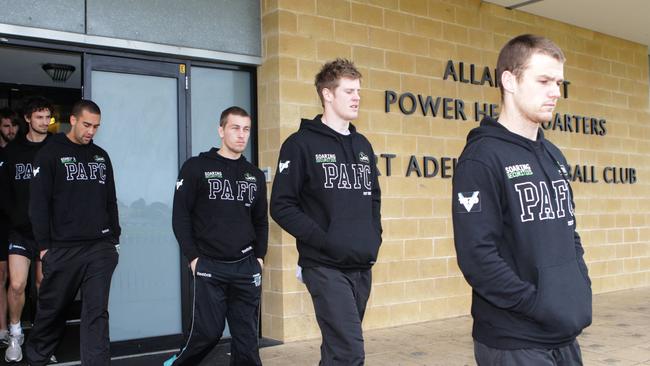 Port Adelaide players leave a meeting after another loss in 2012.