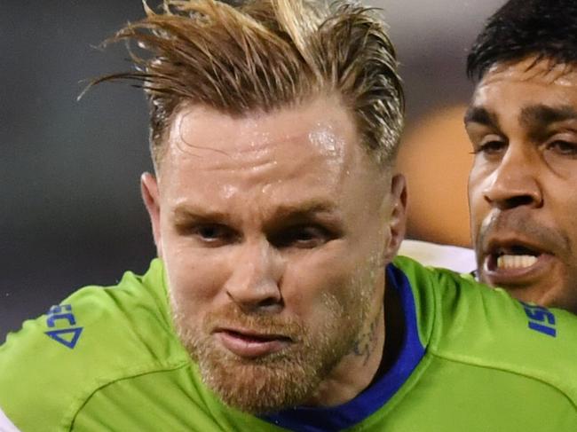 Blake Austin of the Raiders (left) is tackled by Tyrone Peachey of the Panthers during the Round 14 NRL match between the Canberra Raiders and the Penrith Panthers at GIO Stadium in Canberra, Friday, June 8, 2018. (AAP Image/Lukas Coch) NO ARCHIVING, EDITORIAL USE ONLY