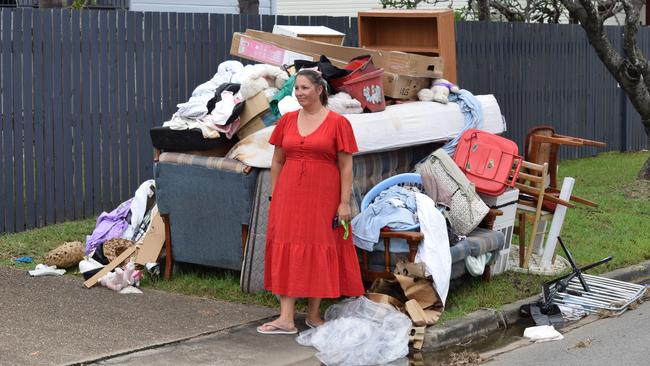 Dawn Kapernick with wrecked items from Merissa's house in Pimlico. Picture: Nikita McGuire