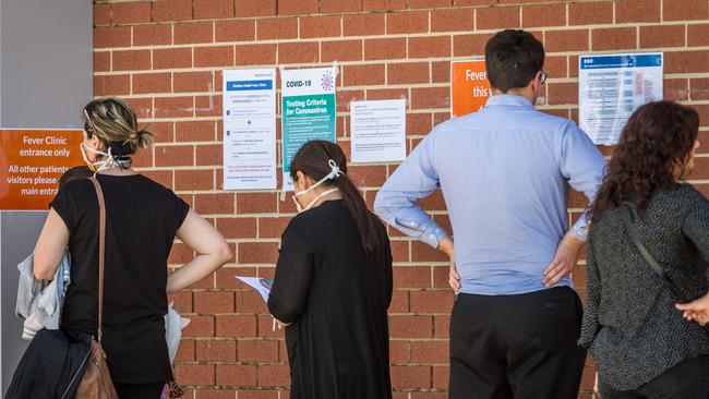 People queue for a fever clinic at Epping Hospital in Sydney. Picture: Jake Nowakowski.