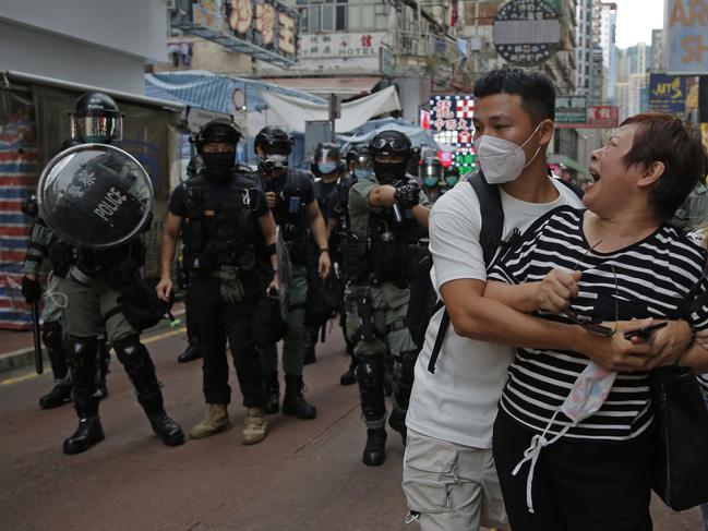 A woman argues with police in Hong Kong. Picture: AP