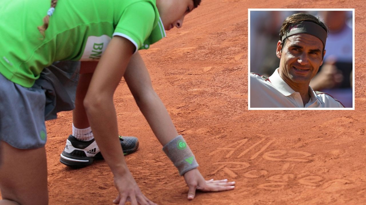 Roger Federer was touched by a message written in the Roland Garros clay by a ball kid. Pictures: AFP