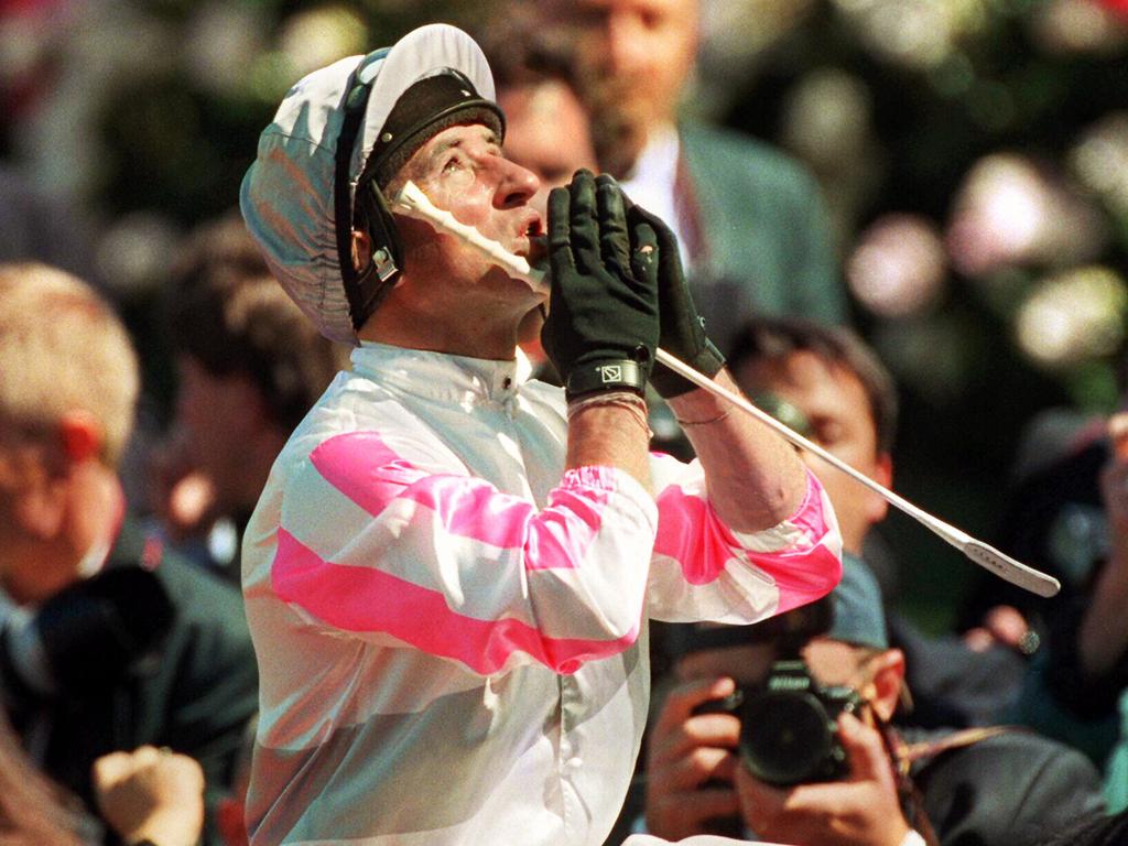 Legendary jockey Jim Cassidy praying after riding Might And Power back to victory in the 1997 Melbourne Cup